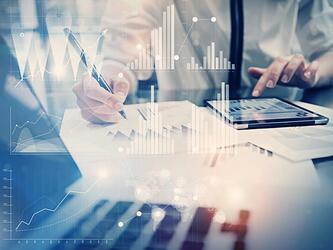 person using tablet and graphs, concept of data and insight